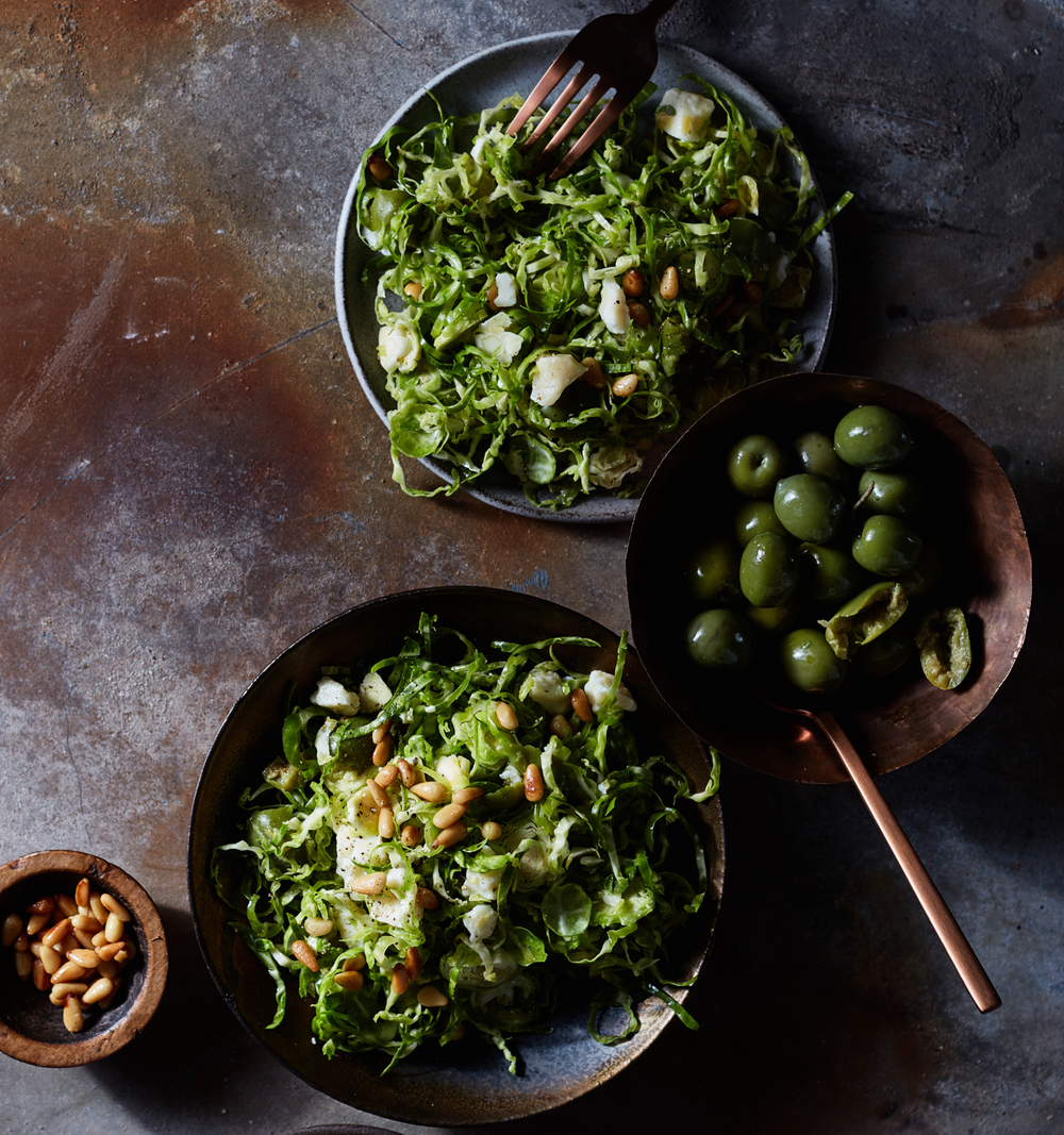 SHAVED BRUSSELS SPROUTS PINE NUTS AND GREEN OLIVES